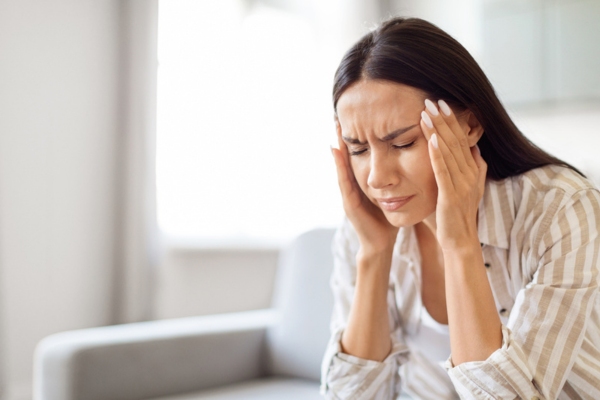 woman feeling nauseous due to carbon monoxide