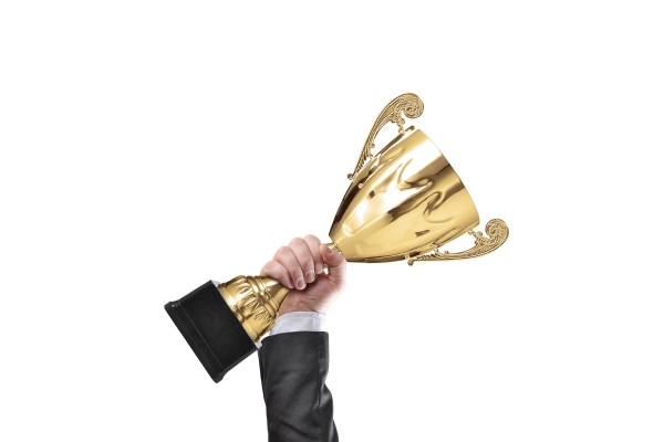 hand and trophy depicting Broco Energy small business owner of the year