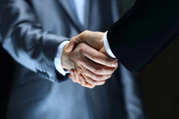 image of two businessmen doing handshake depicting Renewable Energy Group (REG) and Broco Energy® partnership