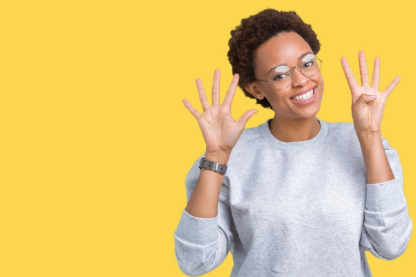 woman holding 9 fingers up depicting ways of propane use