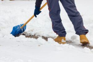 contractor removing snow on the road
