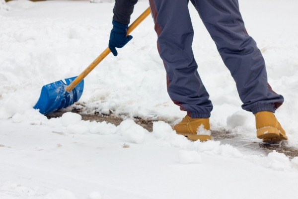contractor removing snow on the road