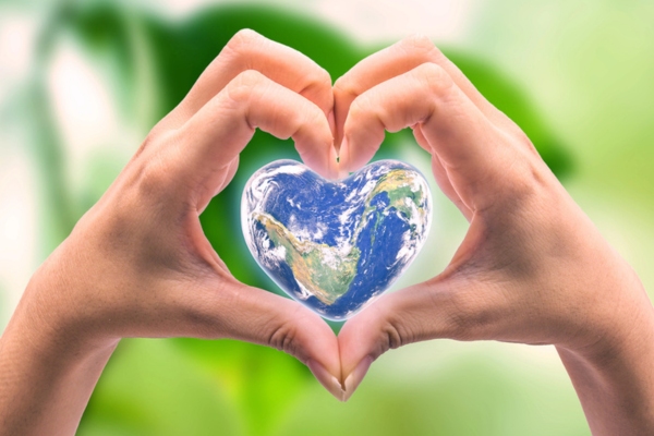 Earth in heart shaped by a woman's hands depicting Bioheat® Fuel