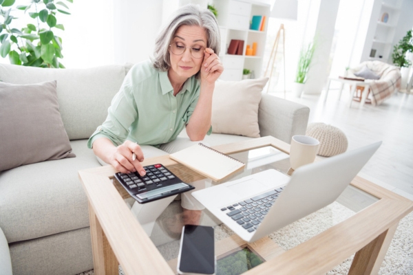 woman computing budget for fuel costs