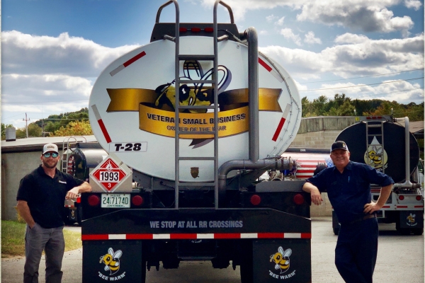Broco Energy heating oil truck with company leaders