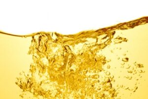 gold liquid with bubbles depicting heating oil