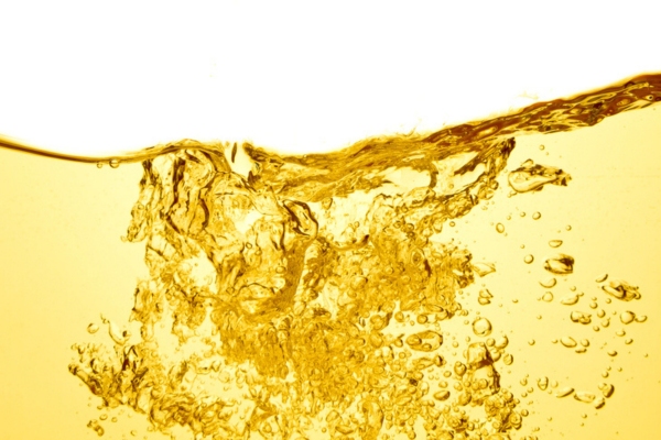 gold liquid with bubbles depicting heating oil
