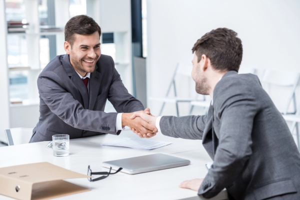 two businessmen shaking hands depicting Public-Private Partnerships