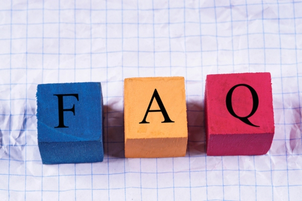 Colorful cubes with an inscription FAQ on crumpled paper depicting questions about Commercial Propane Supplier