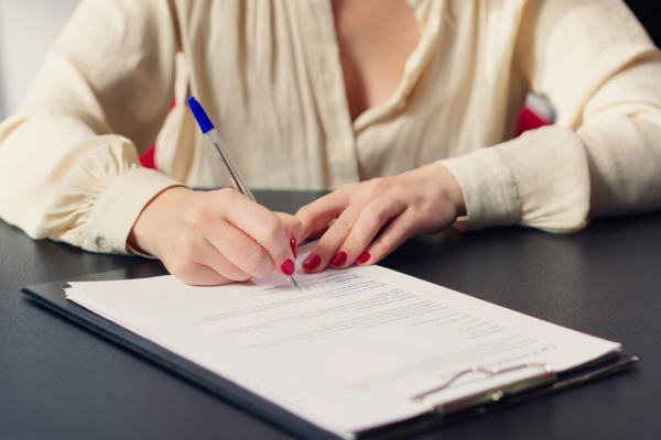 businessowner signing propane supplier contract