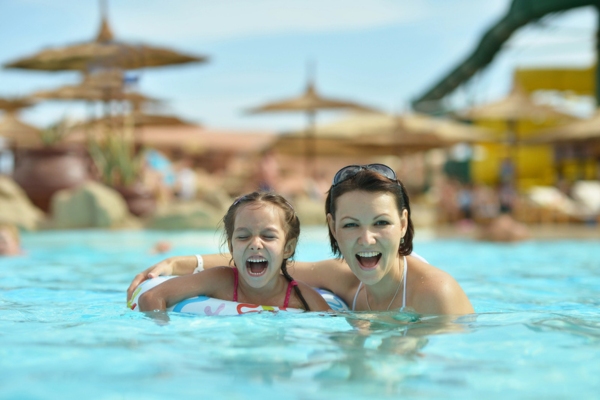 mother and daughter in propane heated pool