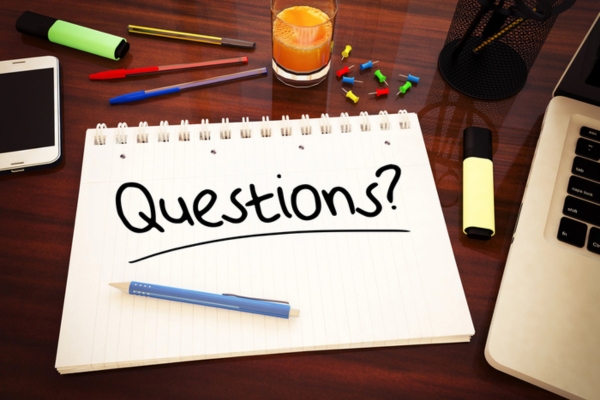 questions written on a notebook depicting common questions about Kitchen Faucet Repair