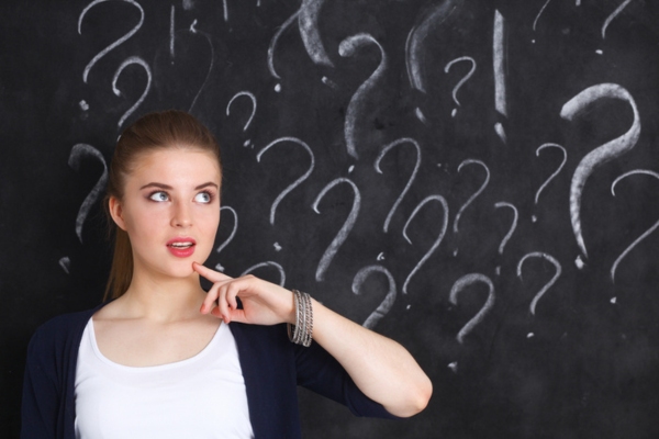 woman wondering with question mark doodles behind her depicting Smart Oil Tank Gauge