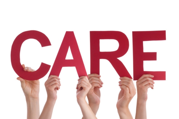 CARE word spelled using cutout letters lifted by different hands depicting Winter Propane Tank Care Tips