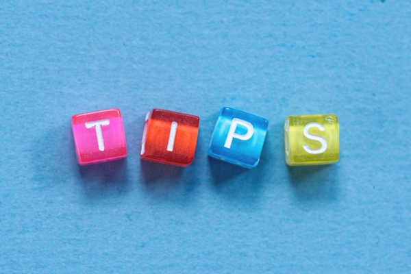 TIPS spelled using plastic colorful letter beads