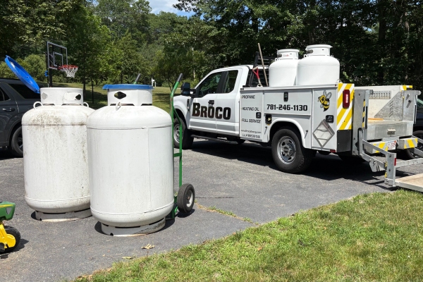 propane tanks on the ground and on a Broco Energy truck