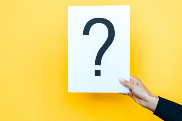 hand holding a paper with question mark depicting Fuel Oil Company FAQs