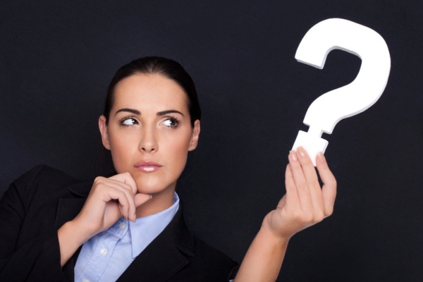 woman holding a question mark depicting Propane Efficiency in 2026 FAQs