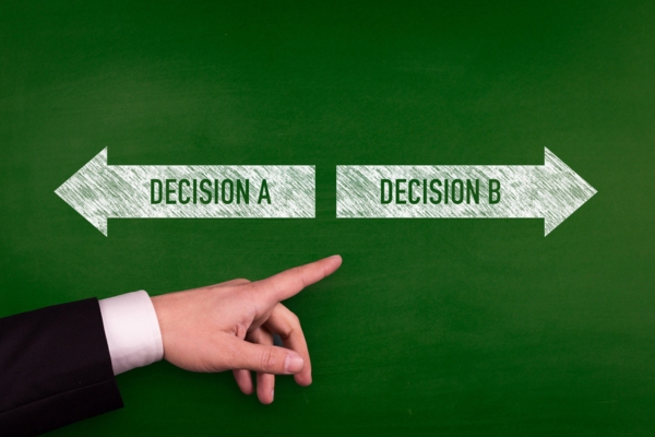 chalkboard with arrows that says decision A and decision B depicting Selecting the Best Propane Delivery Option