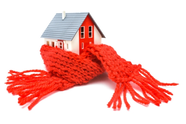 miniature house with a scarf depicting Reasons Heating Oil Delivers Consistent Performance