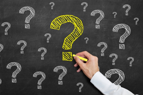 question marks doodled on a chalkboard depicting Trusted Heating Oil FAQs