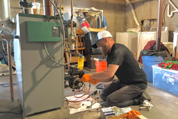 Broco Energy HVAC technician assessing equipment