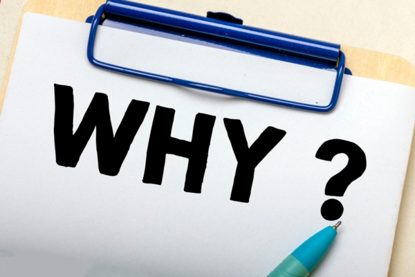 WHY written on paper on a clipboard depicting Why Local Heating Oil Providers Make a Difference All Year