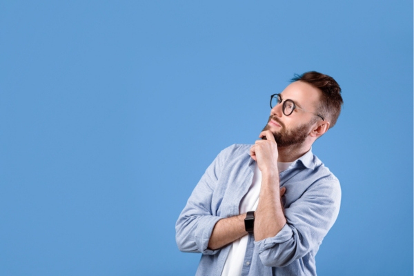 man looking up with hands on chin depicting Understanding a Heating Oil Filter